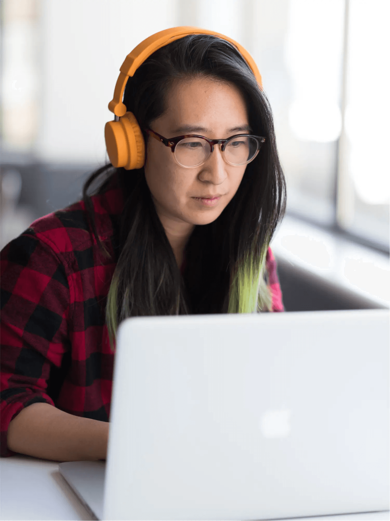 Content marketer at work with headphones on.